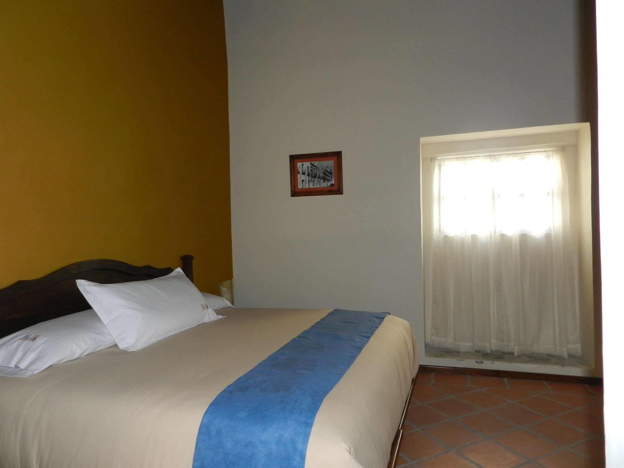 מלון Collection O Al Otro Lado Del Rio, פואבלה מראה חיצוני תמונה A room at the hotel