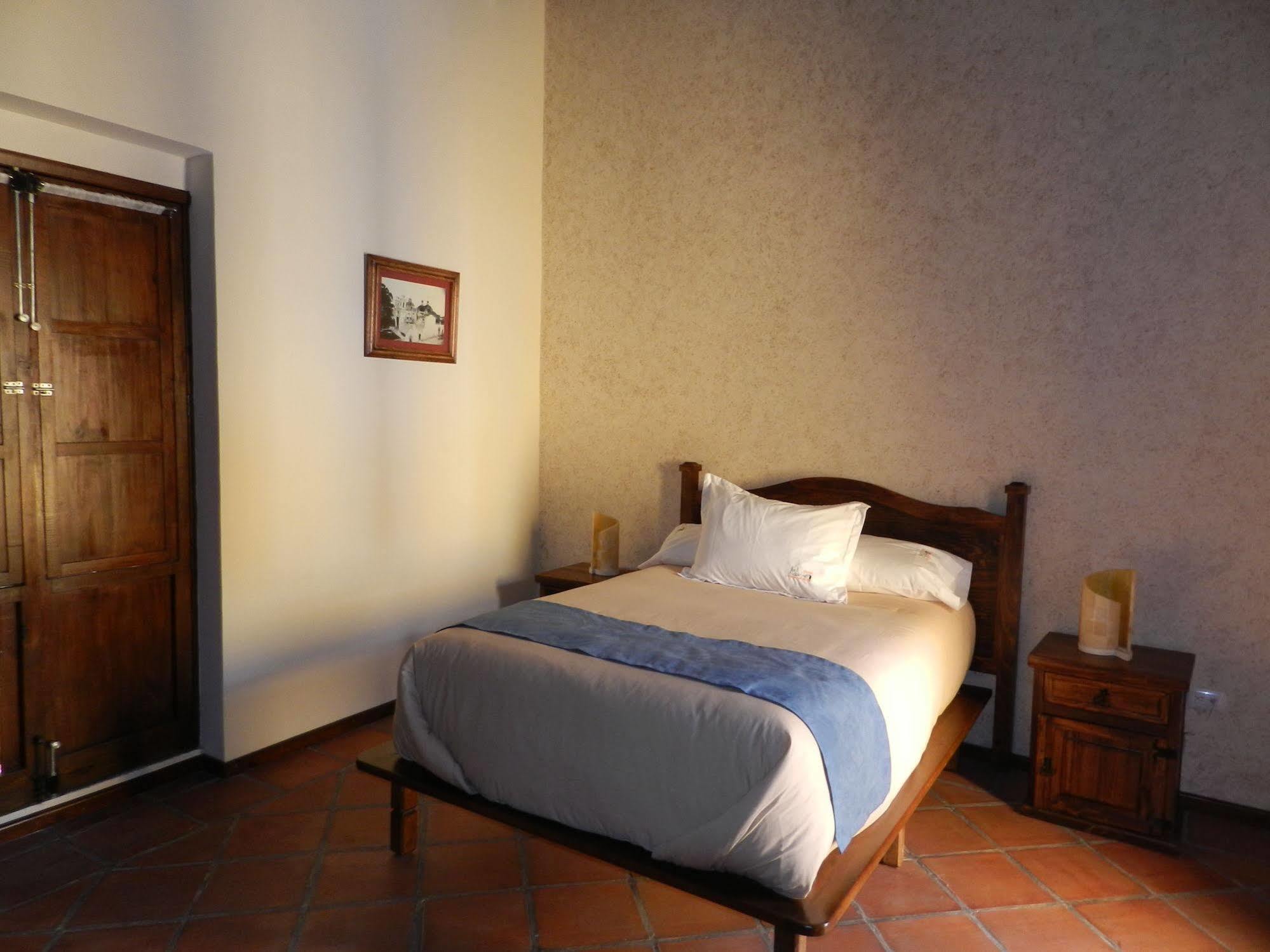 מלון Collection O Al Otro Lado Del Rio, פואבלה מראה חיצוני תמונה A room at the hotel