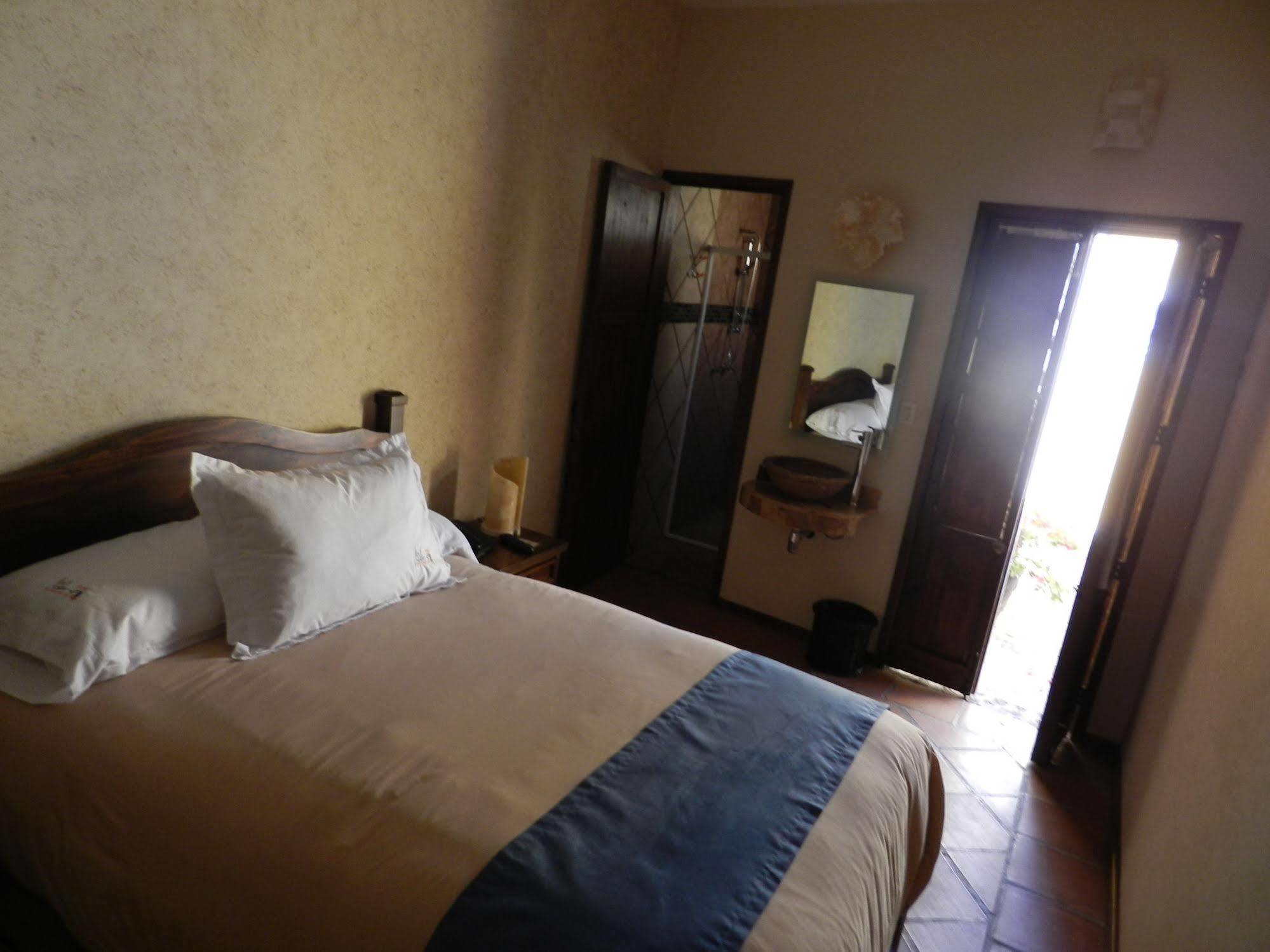 מלון Collection O Al Otro Lado Del Rio, פואבלה מראה חיצוני תמונה A room at the hotel
