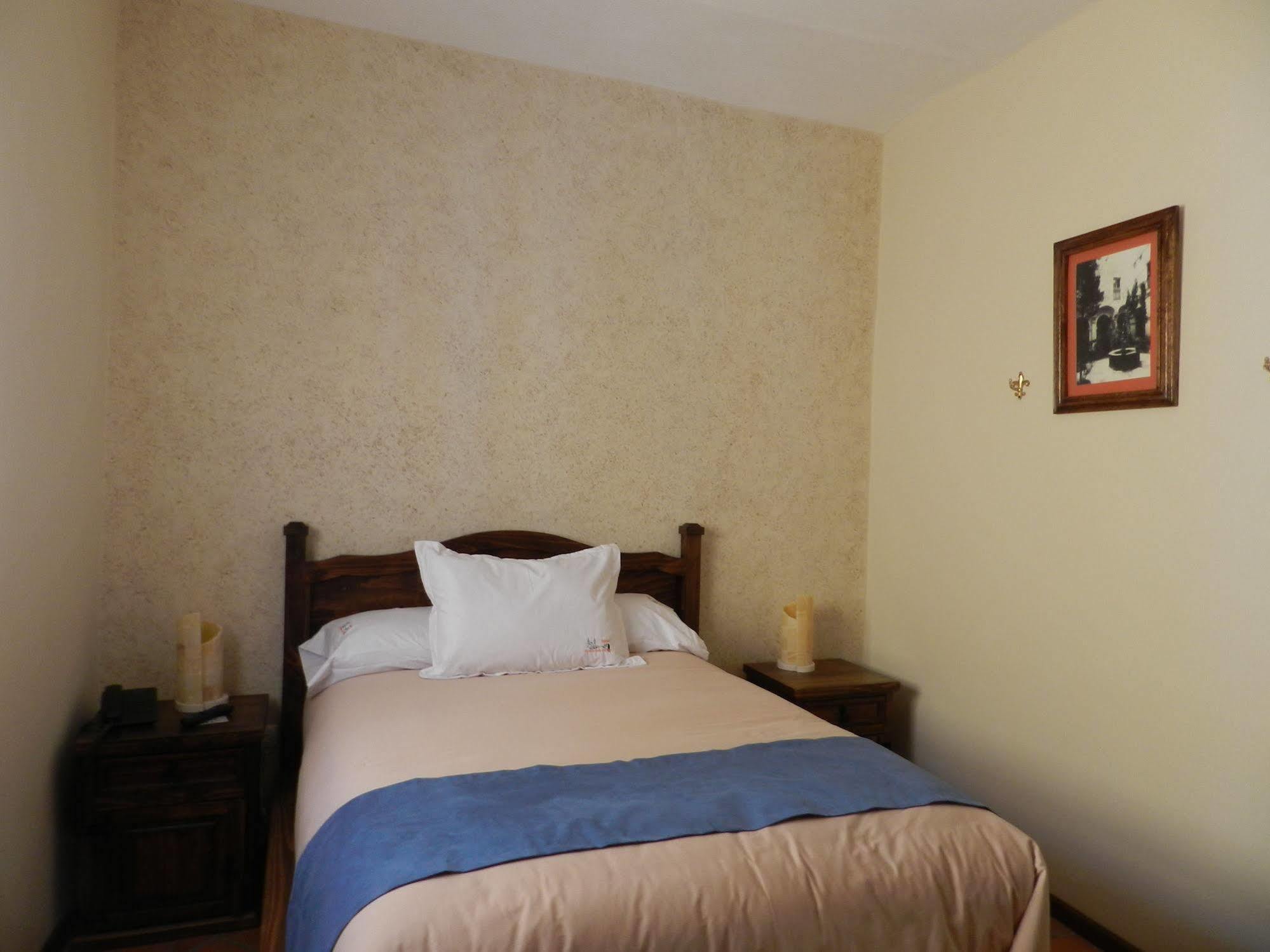 מלון Collection O Al Otro Lado Del Rio, פואבלה מראה חיצוני תמונה A bedroom at the hotel