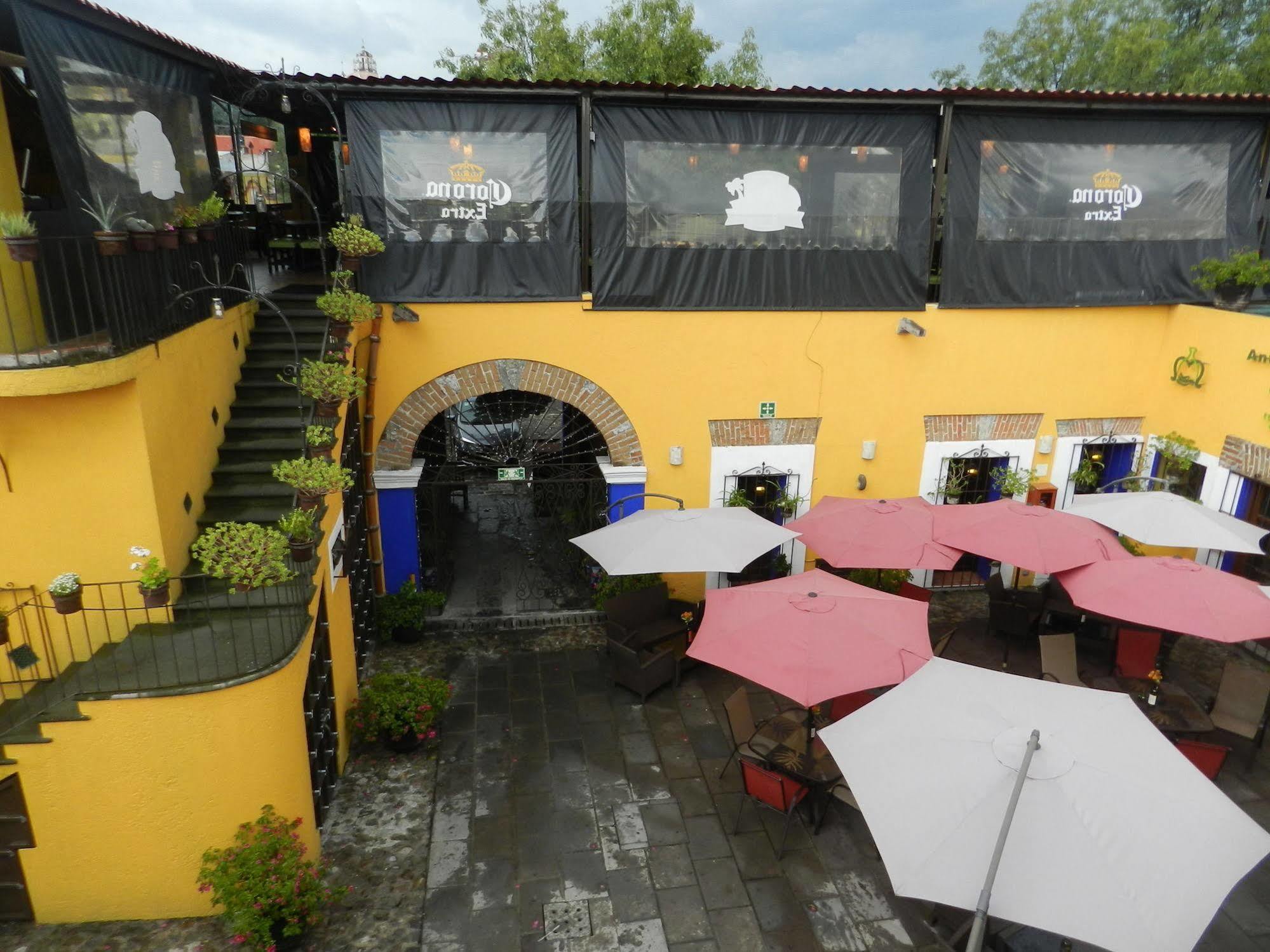 מלון Collection O Al Otro Lado Del Rio, פואבלה מראה חיצוני תמונה The restaurant's patio